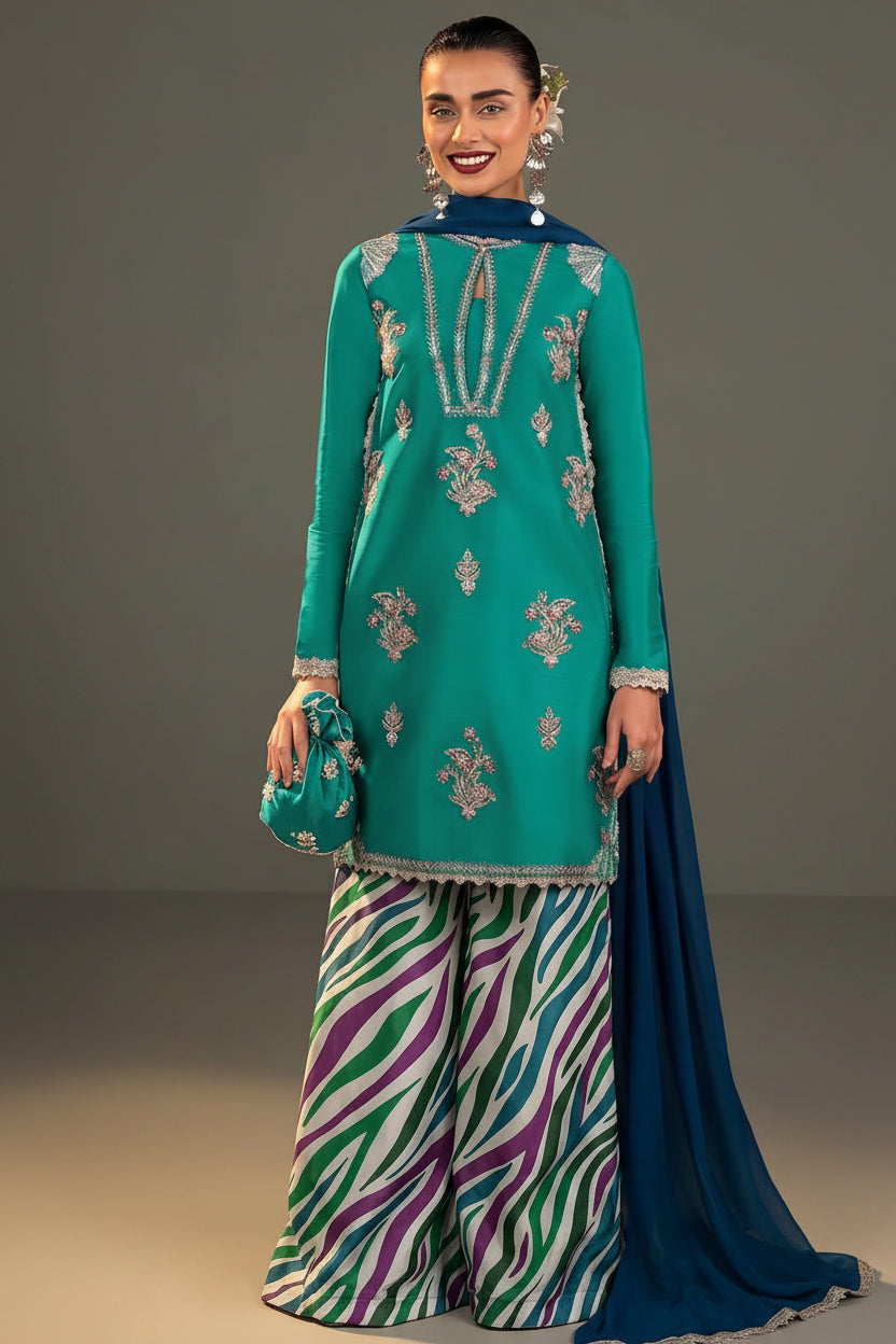 A 3-piece women's ethnic suit set by Zarichar, featuring a teal embroidered kurta, a striped chiffon dupatta, and a printed silk trouser. The image shows a model wearing the set from both front and back angles on a split gray and white background with product details listed in the center.