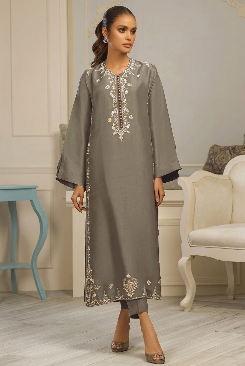 A woman modeling a gray three-piece ethnic wear set, featuring an embroidered Dhanak kurta, shirt, and trouser, presented on a white background with brand text 'SAPPHIRE UNSTICHED WINTER' and product details.