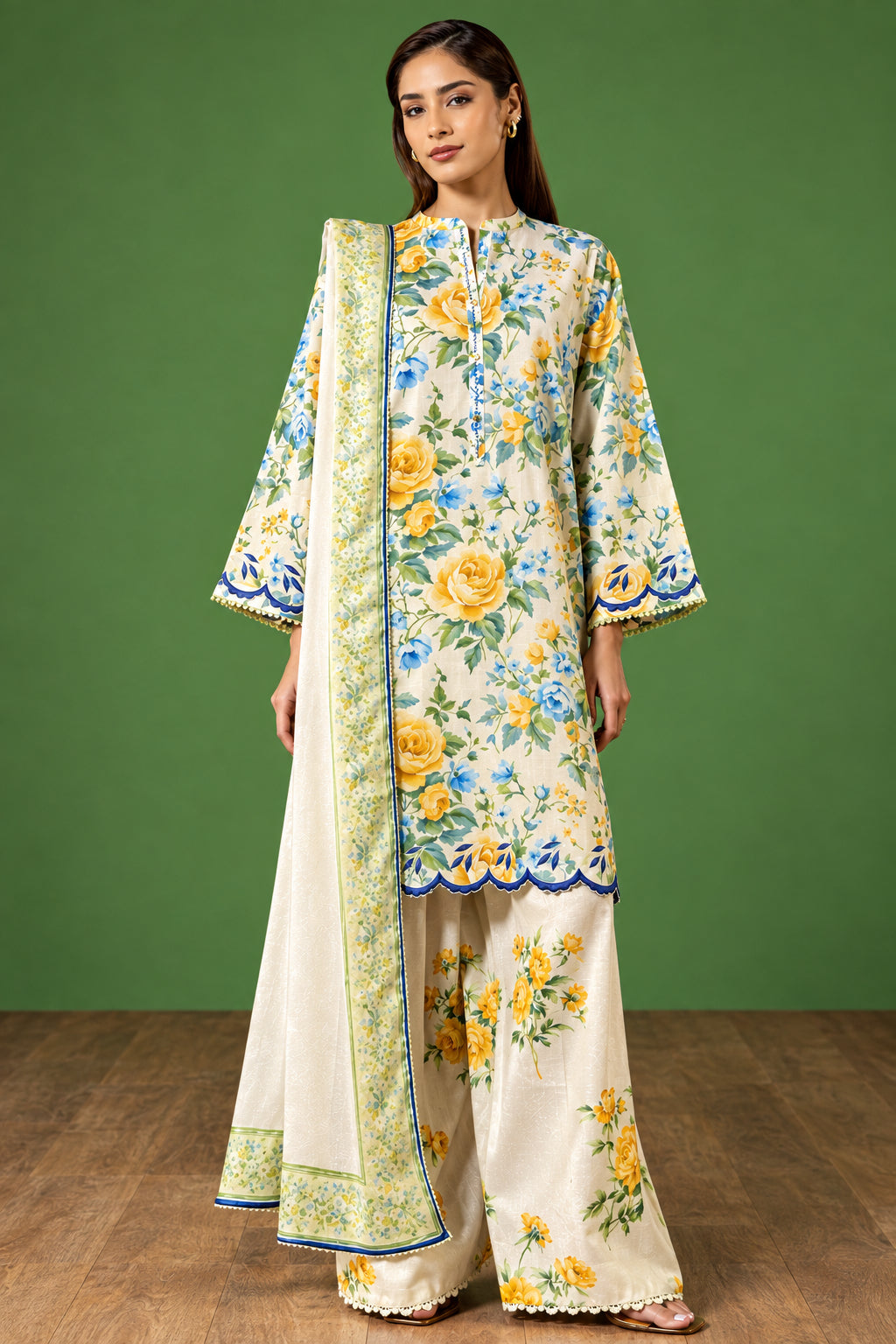 A model wearing a printed traditional outfit stands against a green studio backdrop, with printed text panels on the right showing the brand name COCO BY ZARA SHAHJAHAN, product name AURELIA-7A, package details, and care instructions.