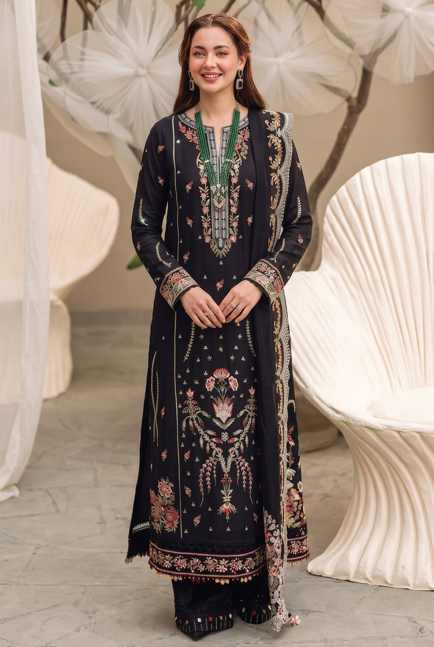 A 3-piece women's ethnic wear set from Shrenz, featuring a black embroidered kurta, trouser, and sleeve, shown on a model in two views against a neutral background. The set features intricate floral embroidery and green beadwork.