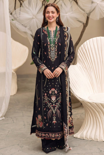 A 3-piece women's ethnic wear set from Shrenz, featuring a black embroidered kurta, trouser, and sleeve, shown on a model in two views against a neutral background. The set features intricate floral embroidery and green beadwork.