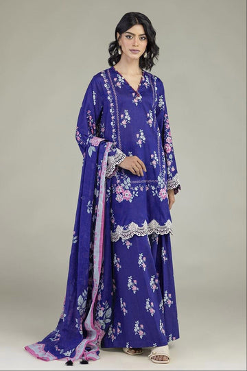 A model wears a purple 3-piece suit set with pink and white floral prints, lace borders, and a matching dupatta. The left side of the image features a white panel with product details, text, and a barcode for Khaadi.