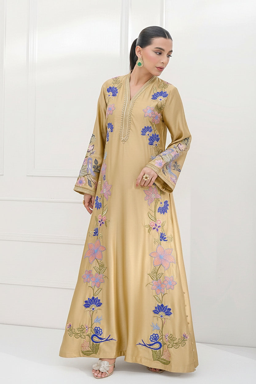 Aurelle brand catalog image showing a model wearing a beige silk embroidered shirt and trouser set. The image features a full-length view on the left, a close-up of the embroidered chest area on the right, and a central text panel detailing the product features and barcode.
