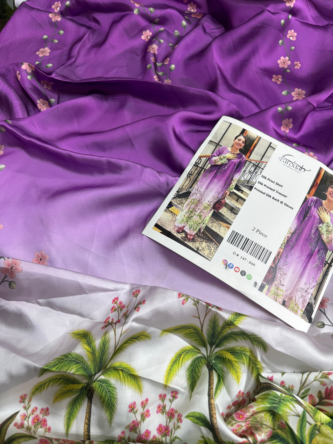 A woman modeling a two-piece purple gradient silk print kurta and trouser set with floral patterns, shown in a split-screen format with a central text panel detailing the product.