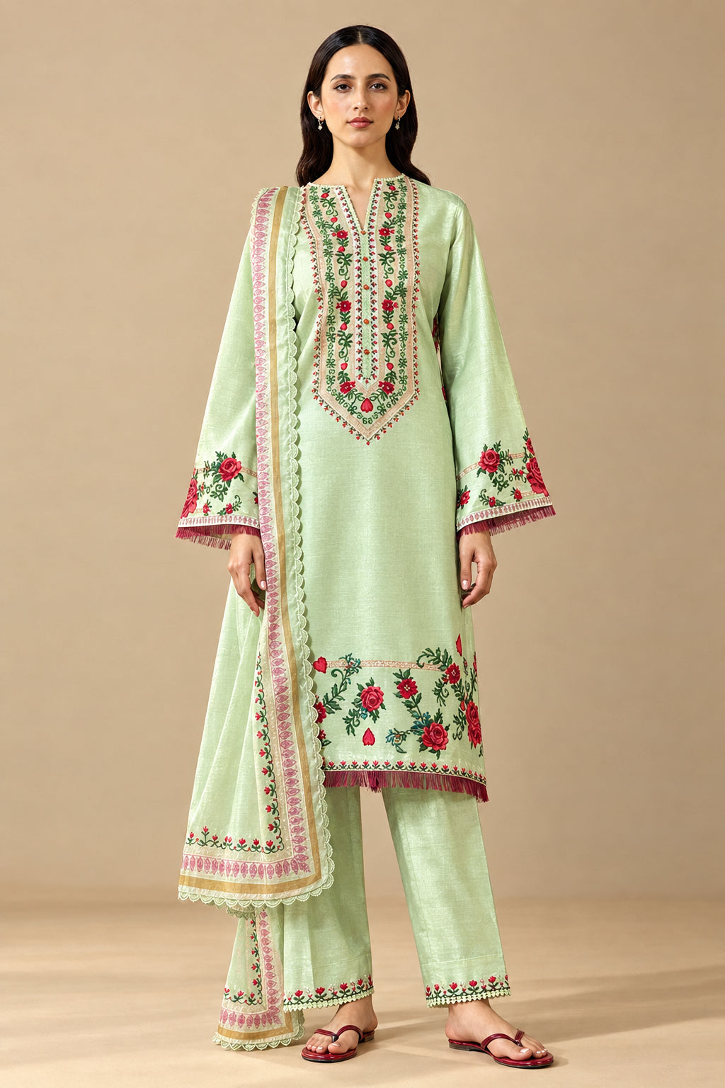 A model wearing a light green printed ethnic suit from ZARA SHAHJAHAN's Coco Prints collection, standing against a beige background next to a text panel detailing the Ismeria-88 outfit.