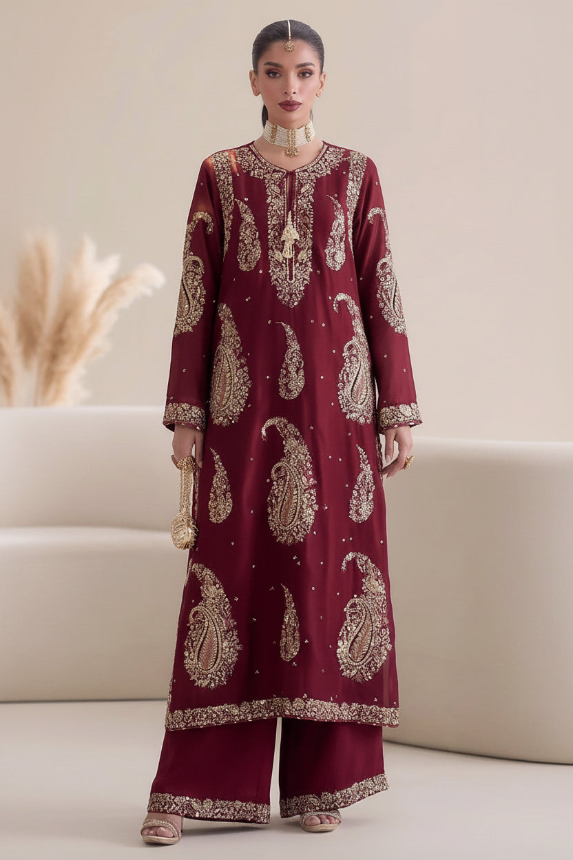 A model is shown wearing a two-piece maroon and gold ethnic salwar kameez set in a studio setting, with text overlays detailing the components of the set on the left and right views.