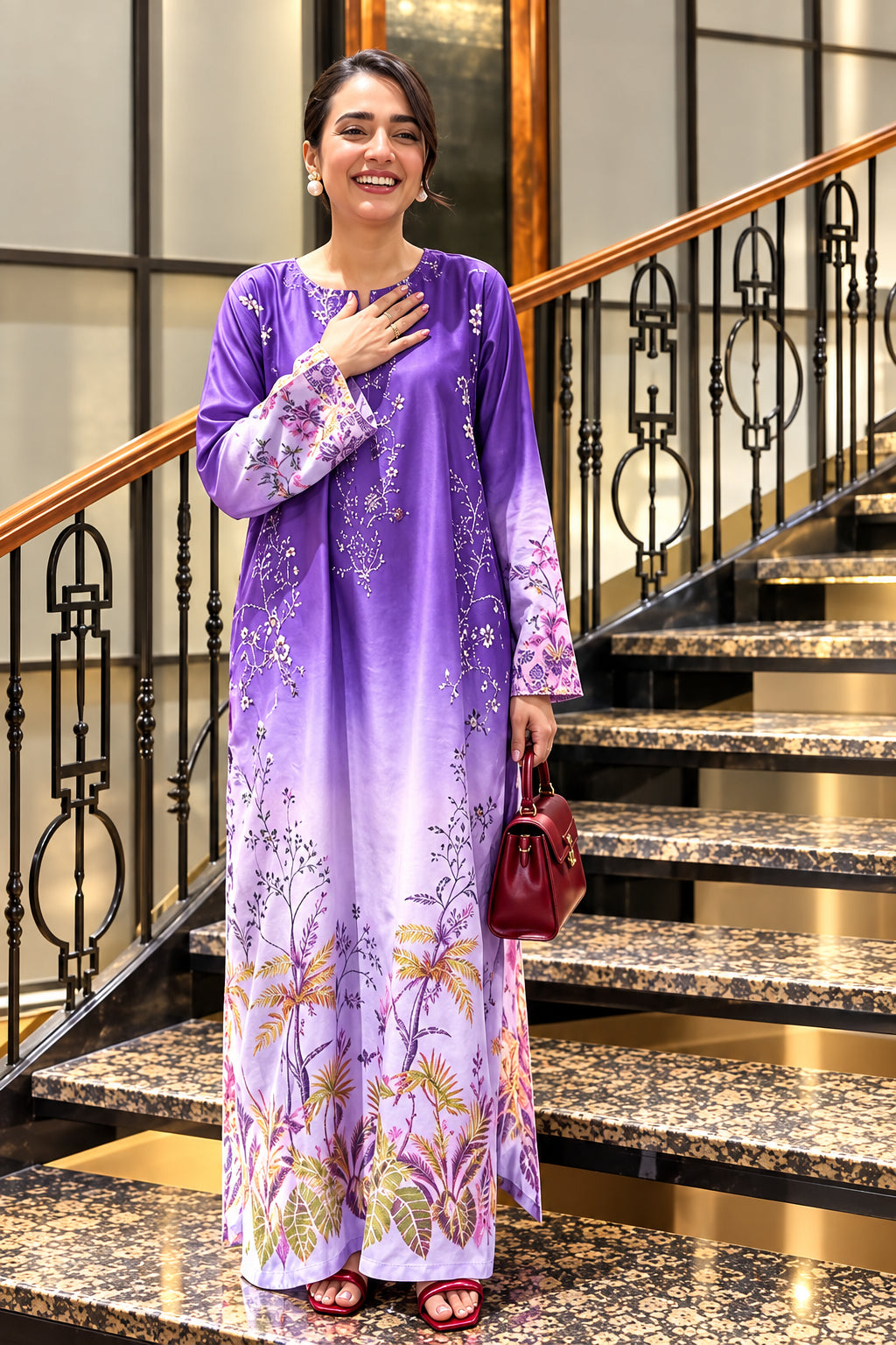 A woman modeling a two-piece purple printed outfit consisting of a long-sleeve satin shirt and trousers, shown in a split-screen presentation with text details in the center.