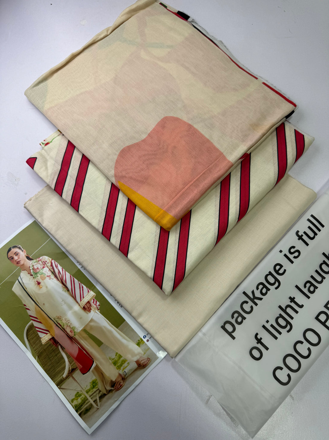 A fashion catalog page for COCO by Zeya Shahidman Prints, featuring a model wearing a printed traditional outfit on the left, with product details and care instructions on the right.
