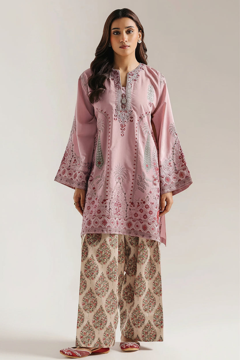 A two-piece women's ethnic outfit shown on a model against a light gray studio background, with close-up and full-body views. The set includes a dusty pink embroidered kurta and beige printed trousers.
