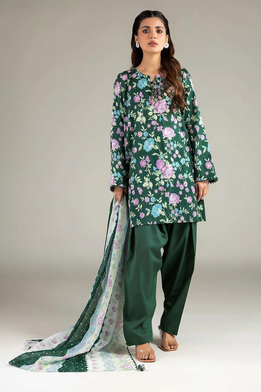 Khaadi 3-piece suit for women in green lawn fabric, featuring a printed long kurta, solid green pants, and a matching printed dupatta, shown on a model against a light gray background with product details on the left.